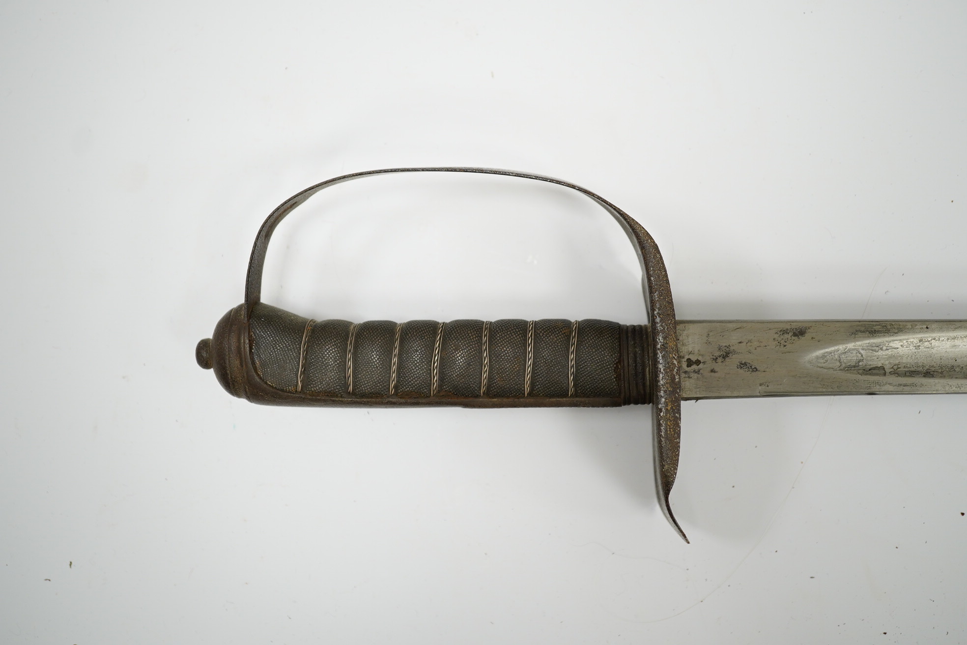 A mid-19th century British infantry sword, by Mole, Birmingham, marked I.S.D., in its leather scabbard with iron chape. Condition - poor, surface rust and knuckle guard significantly cut down.